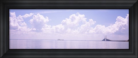 Framed Sea with a container ship and a suspension bridge in distant, Sunshine Skyway Bridge, Tampa Bay, Gulf of Mexico, Florida, USA Print