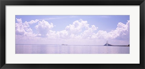 Framed Sea with a container ship and a suspension bridge in distant, Sunshine Skyway Bridge, Tampa Bay, Gulf of Mexico, Florida, USA Print