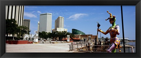Framed Jester statue with buildings in the background, Riverwalk Area, New Orleans, Louisiana, USA Print
