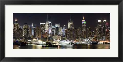 Framed Buildings in a city lit up at night, Hudson River, Midtown Manhattan, Manhattan, New York City, New York State, USA Print