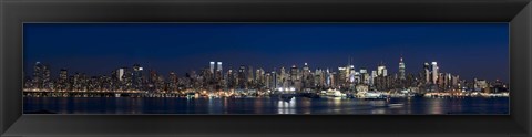 Framed Buildings in a city lit up at dusk, Hudson River, Midtown Manhattan, Manhattan, New York City, New York State, USA Print