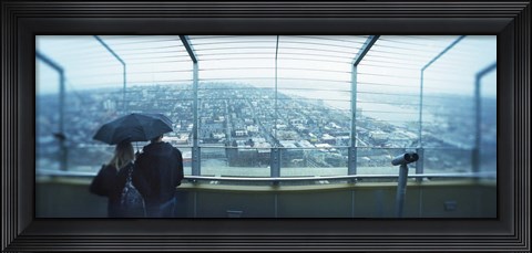Framed Couple viewing a city from the Space Needle, Queen Anne Hill, Seattle, Washington State, USA Print
