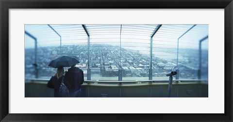 Framed Couple viewing a city from the Space Needle, Queen Anne Hill, Seattle, Washington State, USA Print