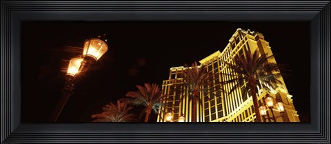 Framed Low angle view of a hotel lit up at night, The Strip, Las Vegas, Nevada, USA Print