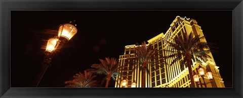 Framed Low angle view of a hotel lit up at night, The Strip, Las Vegas, Nevada, USA Print