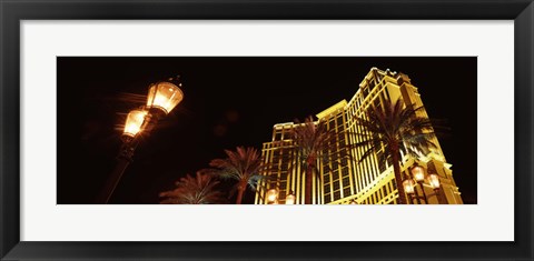 Framed Low angle view of a hotel lit up at night, The Strip, Las Vegas, Nevada, USA Print