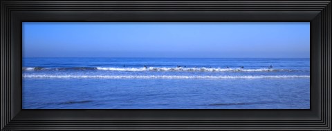 Framed Surfers riding a wave in the sea, Santa Monica, Los Angeles County, California, USA Print