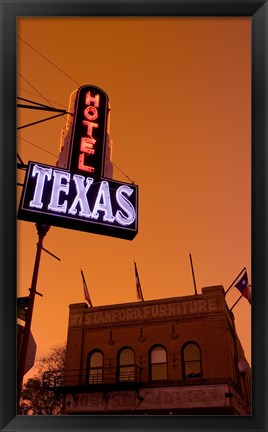 Framed Low angle view of a neon sign of a hotel lit up at dusk, Fort Worth Stockyards, Fort Worth, Texas, USA Print