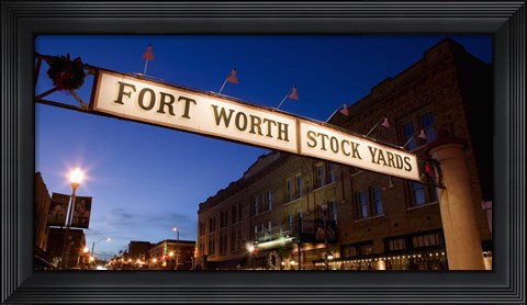 Framed Signboard over a road at dusk, Fort Worth Stockyards, Fort Worth, Texas, USA Print