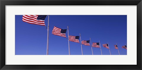 Framed Low angle view of American flags, Washington Monument, Washington DC, USA Print
