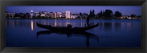 Framed Boat in a lake with city in the background, Lake Merritt, Oakland, Alameda County, California, USA Print