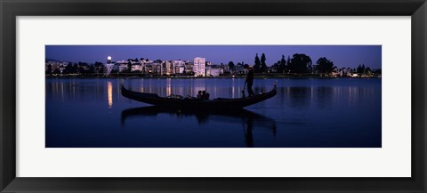 Framed Boat in a lake with city in the background, Lake Merritt, Oakland, Alameda County, California, USA Print