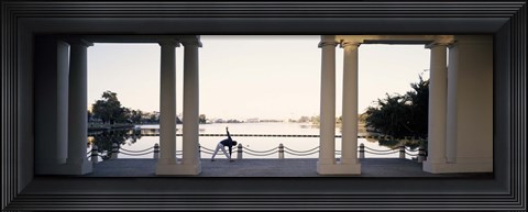 Framed Person stretching near colonnade, Lake Merritt, Oakland, Alameda County, California, USA Print