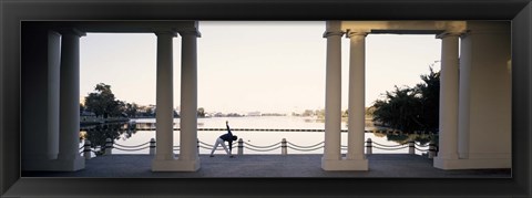 Framed Person stretching near colonnade, Lake Merritt, Oakland, Alameda County, California, USA Print