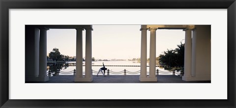 Framed Person stretching near colonnade, Lake Merritt, Oakland, Alameda County, California, USA Print