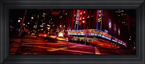 Framed Low angle view of buildings at night, Radio City Music Hall, Rockefeller Center, Manhattan, New York City, New York State, USA Print