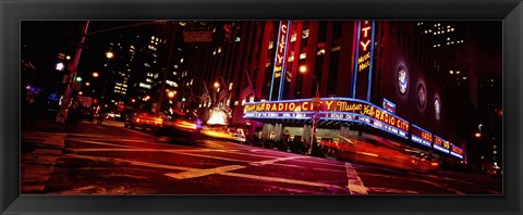 Framed Low angle view of buildings at night, Radio City Music Hall, Rockefeller Center, Manhattan, New York City, New York State, USA Print