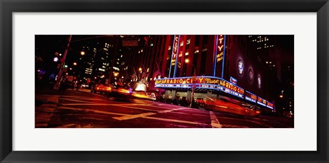 Framed Low angle view of buildings at night, Radio City Music Hall, Rockefeller Center, Manhattan, New York City, New York State, USA Print