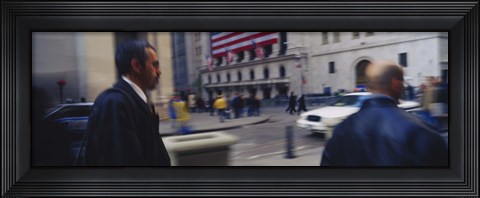 Framed Two people walking, New York Stock Exchange, Wall Street, Times Square, Manhattan, New York City, New York State, USA Print