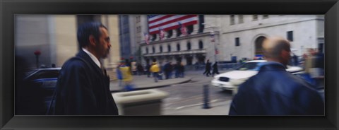 Framed Two people walking, New York Stock Exchange, Wall Street, Times Square, Manhattan, New York City, New York State, USA Print