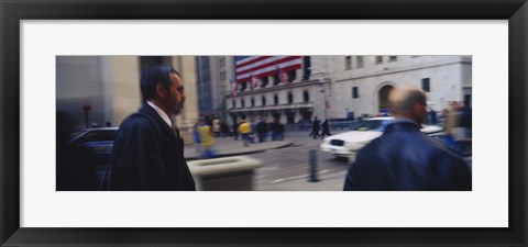 Framed Two people walking, New York Stock Exchange, Wall Street, Times Square, Manhattan, New York City, New York State, USA Print