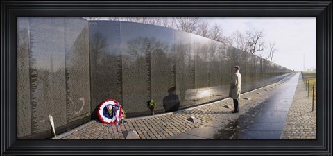 Framed Side profile of a person standing in front of a war memorial, Vietnam Veterans Memorial, Washington DC, USA Print