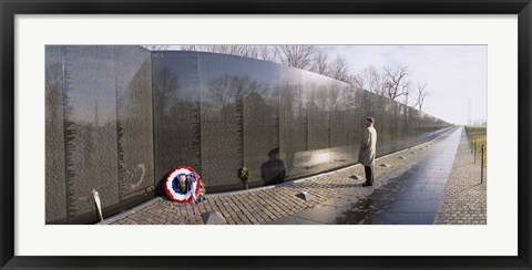 Framed Side profile of a person standing in front of a war memorial, Vietnam Veterans Memorial, Washington DC, USA Print