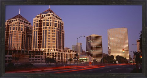 Framed USA, California, Oakland, Alameda County, New City Center, Buildings lit up at night Print