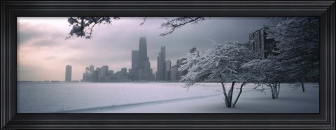 Framed Snow covered tree on the beach with a city in the background, North Avenue Beach, Chicago, Illinois, USA Print