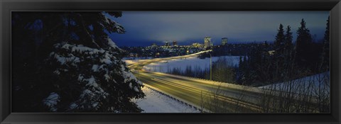 Framed Winding road running through a snow covered landscape, Anchorage, Alaska, USA Print