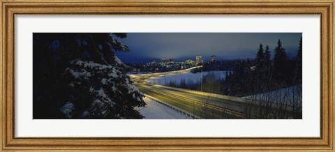 Framed Winding road running through a snow covered landscape, Anchorage, Alaska, USA Print