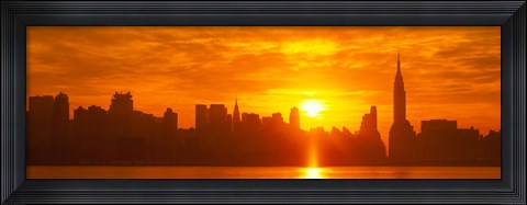 Framed Birght Orange Sky and Sun Behind the New York City Skyline Print