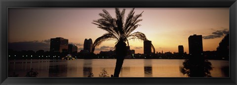 Framed Silhouette of buildings at the waterfront, Lake Eola, Summerlin Park, Orlando, Orange County, Florida, USA Print