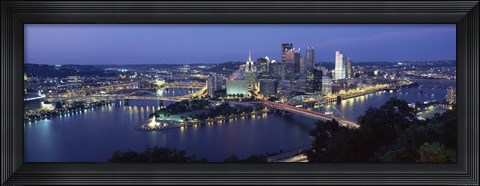 Framed Buildings along a river lit up at dusk, Monongahela River, Pittsburgh, Allegheny County, Pennsylvania, USA Print