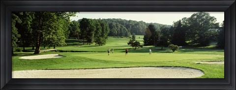 Framed Four people playing on a golf course, Baltimore County, Maryland, USA Print