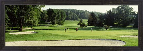 Framed Four people playing on a golf course, Baltimore County, Maryland, USA Print
