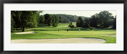 Framed Four people playing on a golf course, Baltimore County, Maryland, USA Print