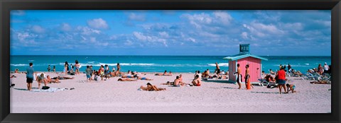 Framed Tourist on the beach, Miami, Florida, USA Print