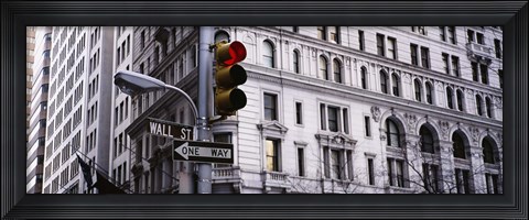 Framed Low angle view of a Red traffic light in front of a building, Wall Street, New York City Print