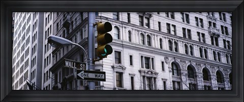 Framed Low angle view of a Green traffic light in front of a building, Wall Street, New York City Print