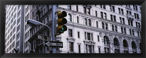 Framed Low angle view of a Green traffic light in front of a building, Wall Street, New York City Print