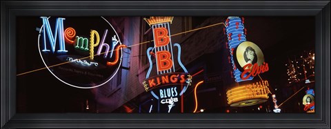 Framed Low angle view of neon signs lit up at night, Beale Street, Memphis, Tennessee, USA Print