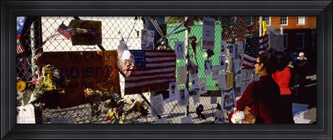 Framed Side profile of a woman standing in front of chain-link fence at a memorial, New York City, New York State, USA Print