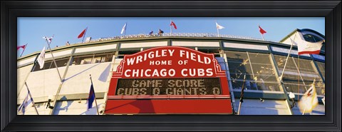 Framed Red score board outside Wrigley Field,USA, Illinois, Chicago Print