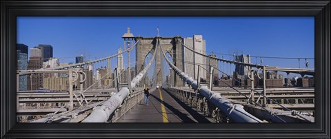 Framed Rear view of a woman walking on a bridge, Brooklyn Bridge, Manhattan, New York City, New York State, USA Print