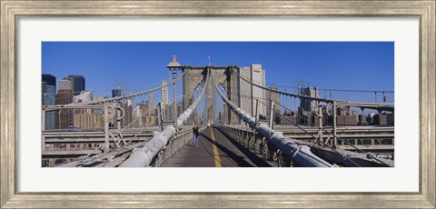 Framed Rear view of a woman walking on a bridge, Brooklyn Bridge, Manhattan, New York City, New York State, USA Print