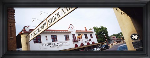 Framed Low angle view of a commercial signboard, Fort Worth Stockyards, Fort Worth, Texas, USA Print