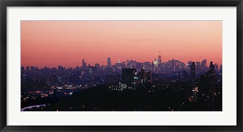 Framed High angle view of buildings lit up at dusk, Manhattan, New York City, New York State, USA Print