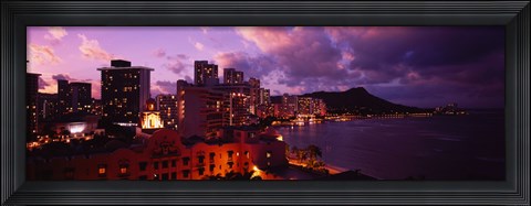 Framed Buildings lit up at dusk, Waikiki, Oahu, Hawaii, USA Print