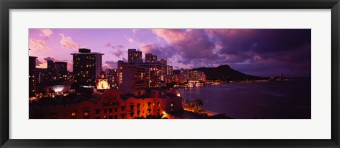 Framed Buildings lit up at dusk, Waikiki, Oahu, Hawaii, USA Print